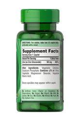 Puritan's Pride Zinc 50 mg supplement bottle with supplement facts label and recommended serving details.